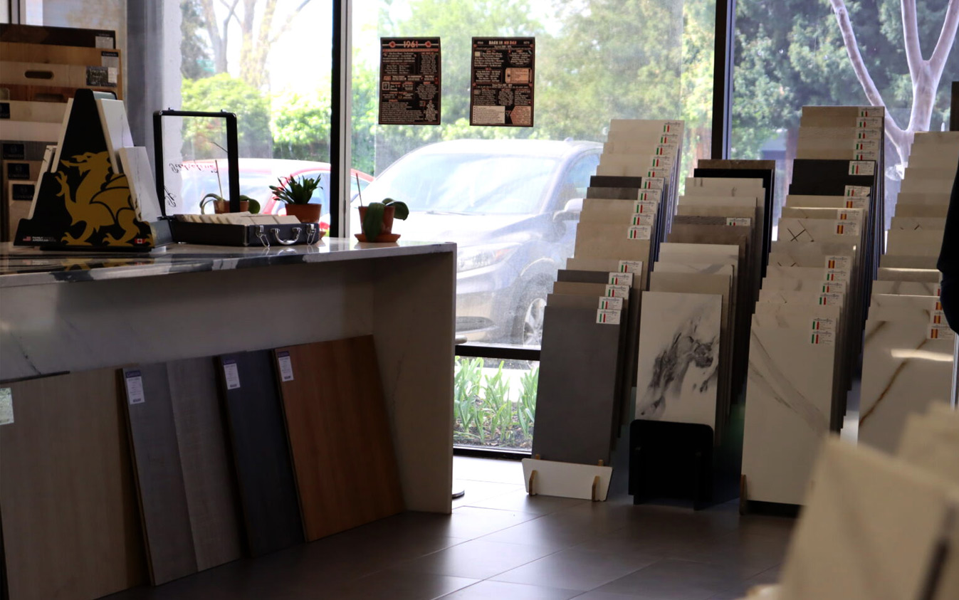 Showroom-style materials inspiration with coordinated slabs, tile, and flooring for kitchens and bathrooms